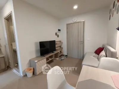 Modern living room with stylish furniture and neutral tones, perfect for cozy living.