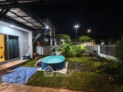 Charming backyard with small pool and lush greenery, perfect for relaxation and outdoor enjoyment.