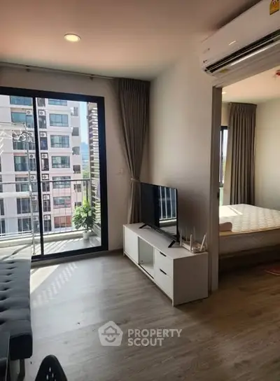 Modern living room with balcony view in urban apartment