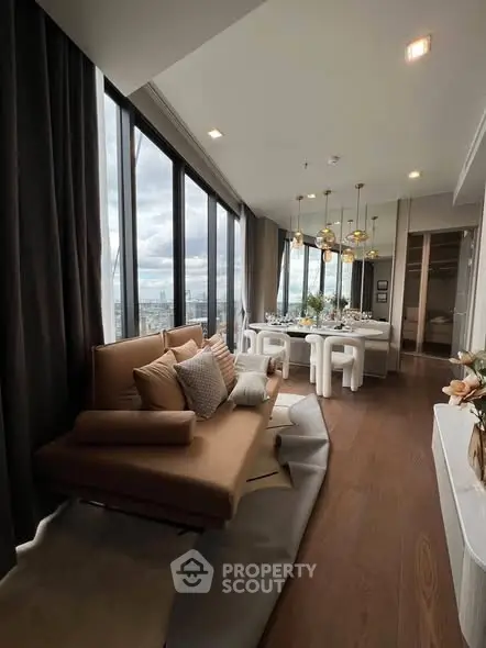 Luxurious modern living room with panoramic city views and elegant dining area.