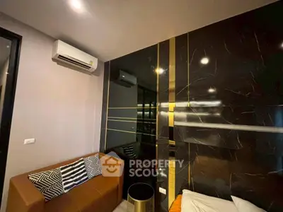 Modern living room with stylish decor and air conditioning unit