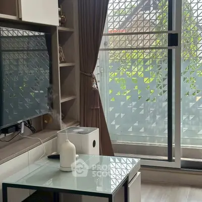 Modern living room with sleek design and balcony view