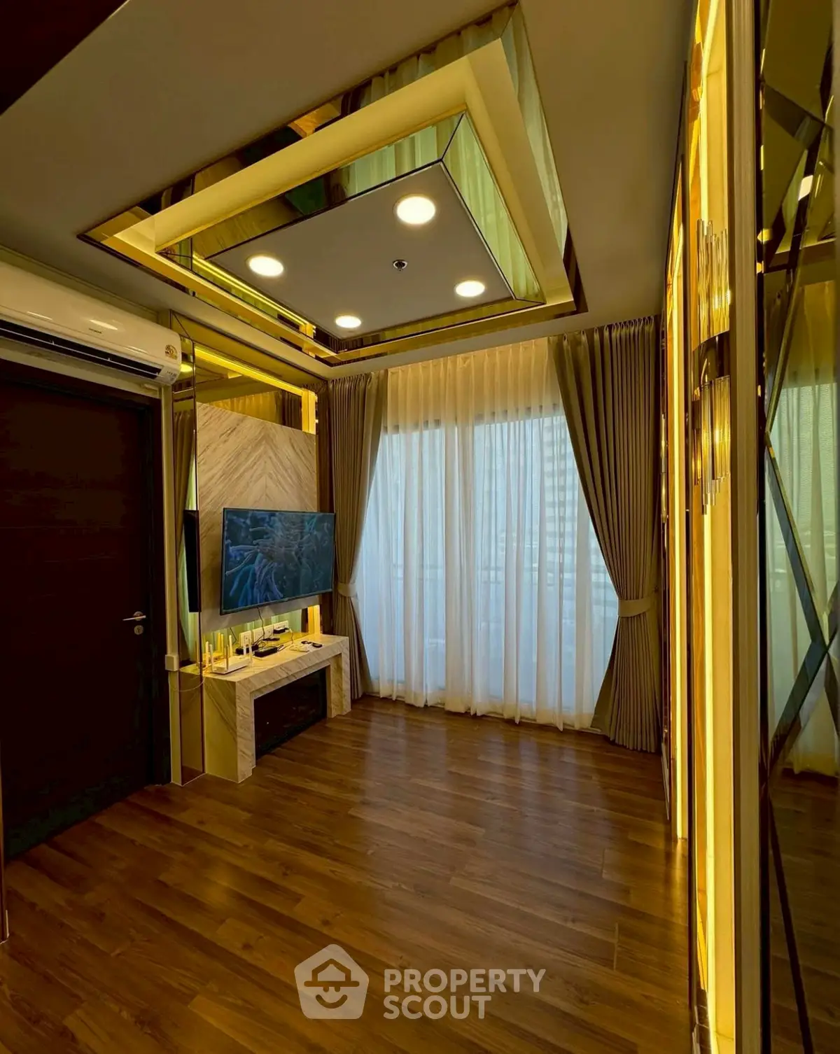 Luxurious living room with modern lighting and elegant wooden flooring.