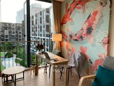 Chic urban living room with vibrant koi fish wall art, opening onto a balcony with a serene garden view, perfect for modern city life.