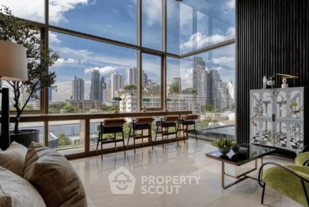 Luxurious living room with floor-to-ceiling windows offering stunning city skyline views.