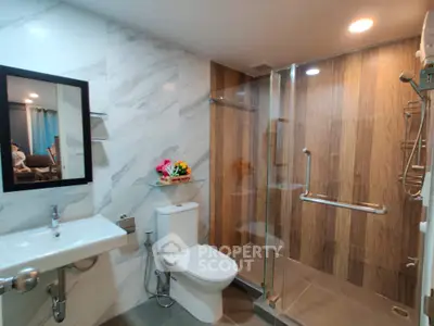 Modern bathroom with glass shower and elegant marble walls