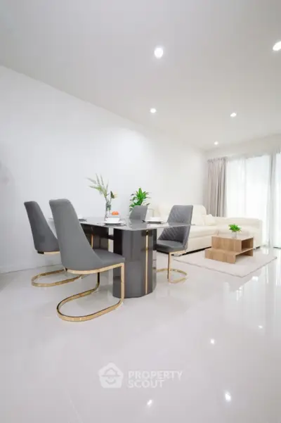 Modern living room with elegant dining area and stylish furniture