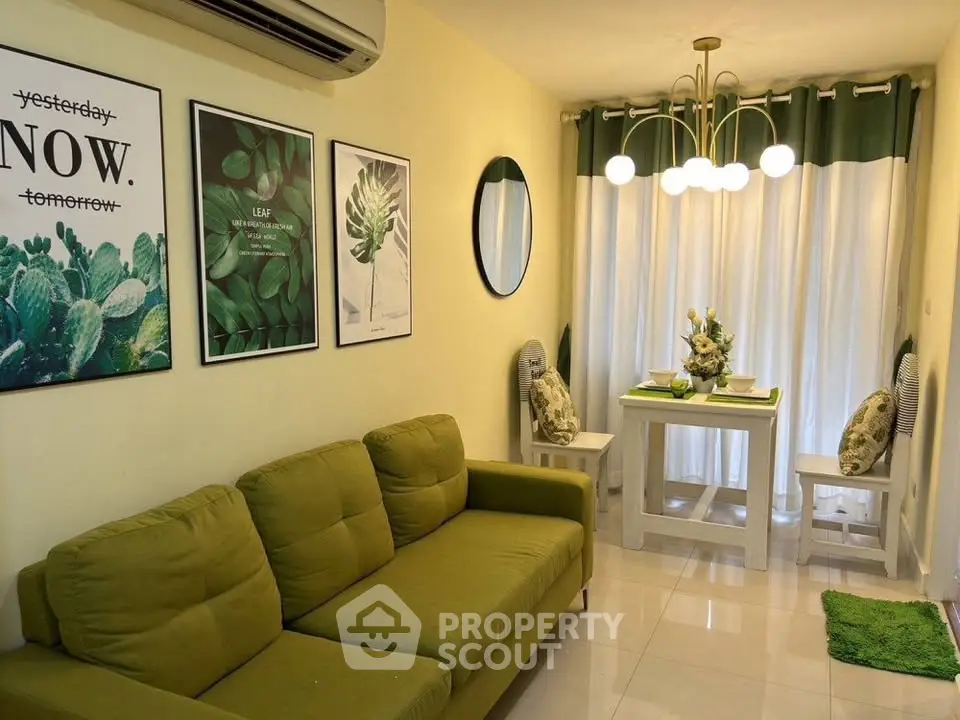 Charming living room with green sofa and modern decor, perfect for cozy gatherings.