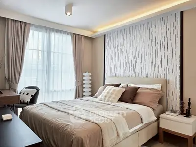 Elegant bedroom with modern decor and large window for natural light