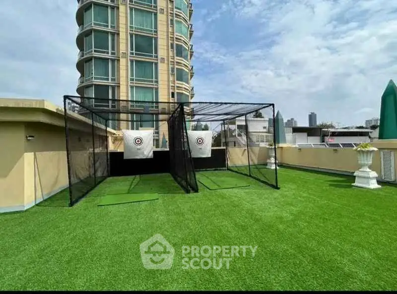 Luxurious rooftop with golf practice nets and stunning city views
