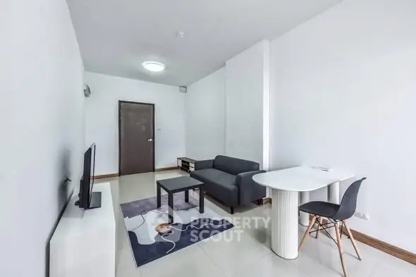 Modern minimalist living room with sleek furniture and neutral tones