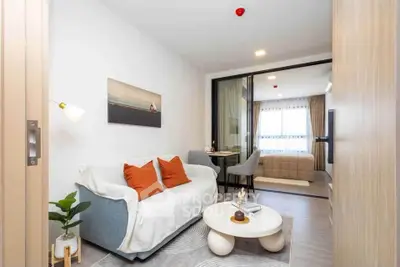 Modern living room with cozy sofa and stylish decor in a bright apartment