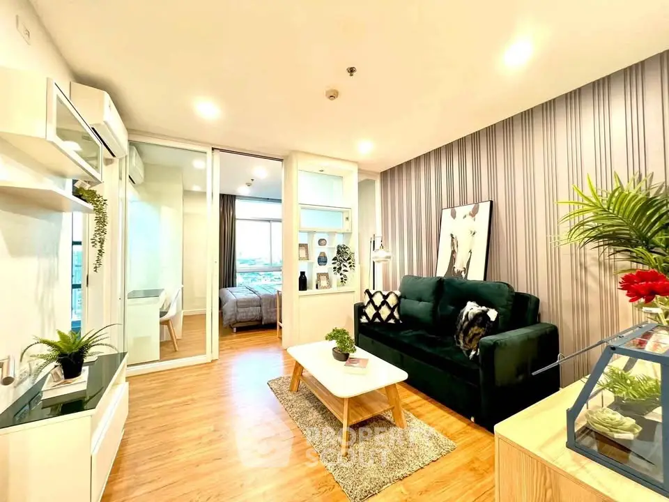 Modern living room with stylish decor and view into cozy bedroom