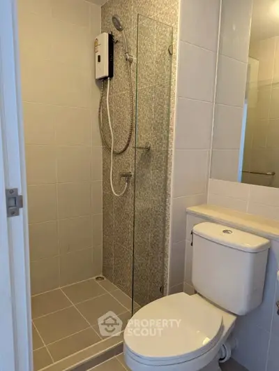 Modern bathroom with shower and toilet in sleek design