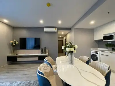 Modern living room with elegant dining area and stylish decor