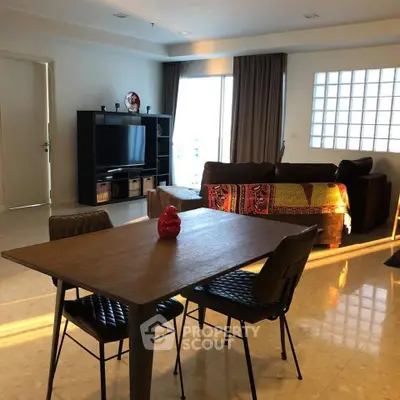 Spacious living room with modern decor and natural light