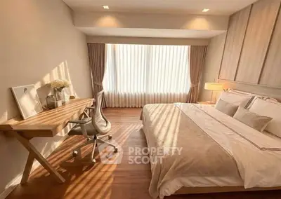 Elegant bedroom with natural light and modern decor