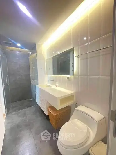 Modern bathroom with sleek design and ambient lighting