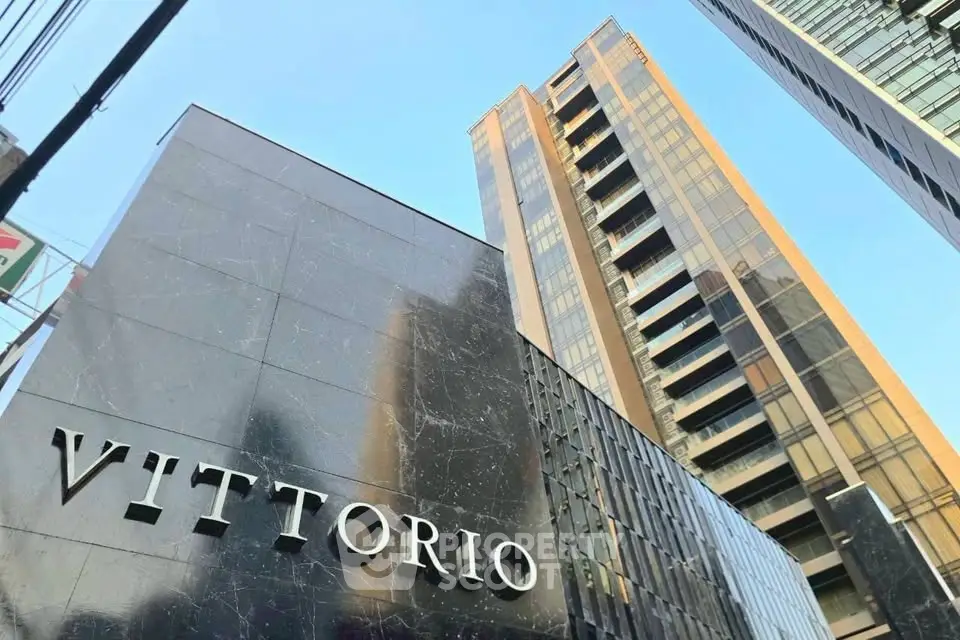 Stunning modern high-rise building with sleek architecture and luxurious facade in prime urban location.