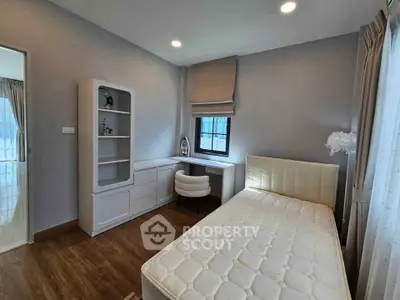 Modern minimalist bedroom with sleek furniture and natural light