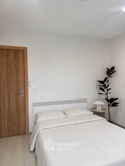 Cozy bedroom with minimalist decor and wooden accents