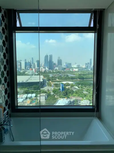 Luxurious bathroom with stunning city view from large window