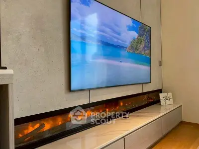 Modern living room with wall-mounted TV and sleek electric fireplace
