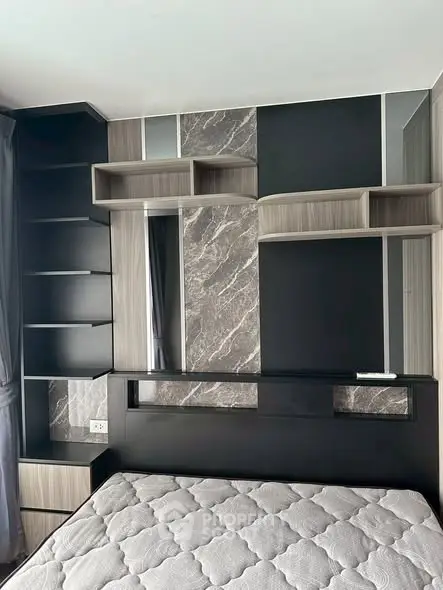 Modern bedroom with stylish shelving and elegant headboard design