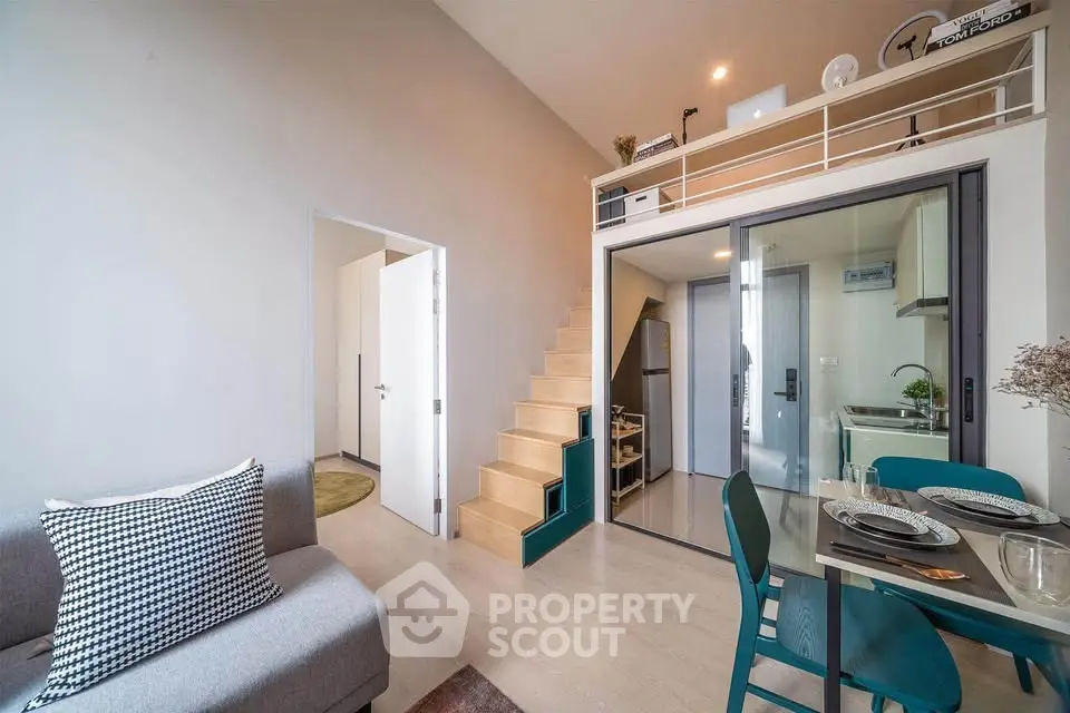 Modern loft apartment with mezzanine, open kitchen, and stylish decor