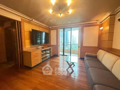 Spacious living room with modern decor and city view balcony access.