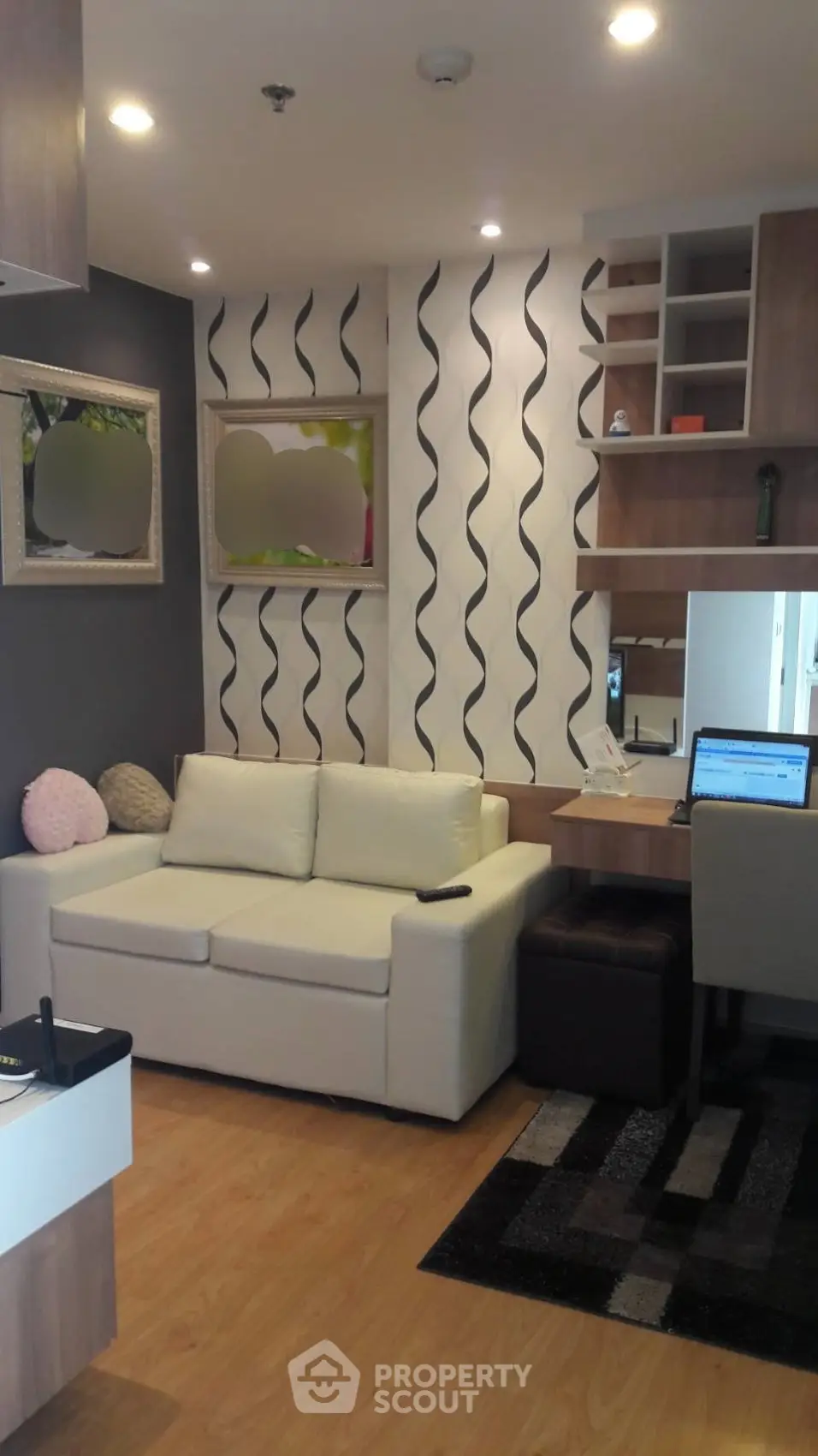 Modern living room with stylish decor and cozy seating area, perfect for relaxation and entertainment.