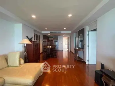 Spacious living room with elegant wooden flooring and modern furnishings