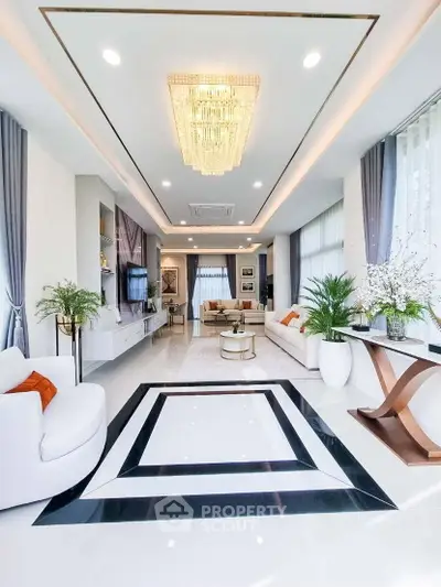 Luxurious modern living room with elegant chandelier and stylish decor
