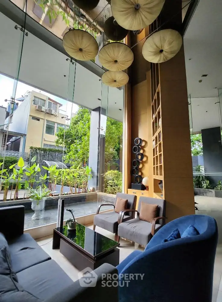 Luxurious modern living room with floor-to-ceiling windows and elegant decor