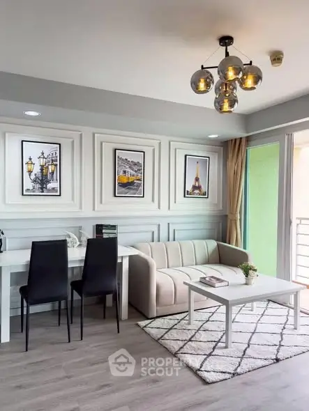 Modern living room with stylish decor and natural light, featuring a cozy sofa and elegant dining area.