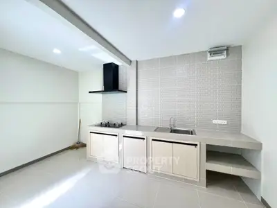 Modern kitchen with sleek gas stove and minimalist design