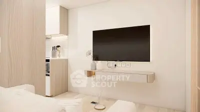 Modern living room with wall-mounted TV and minimalist decor