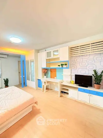 Bright and modern bedroom with stylish built-in storage and cozy decor
