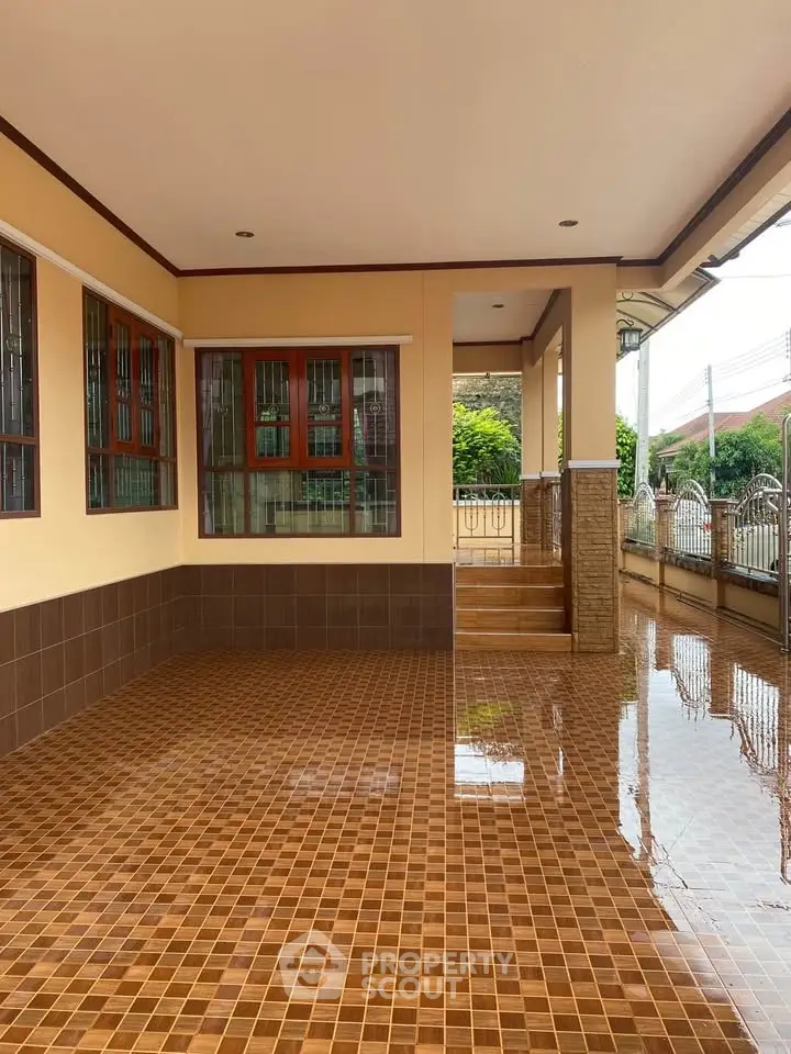 Spacious tiled patio with elegant design and natural light
