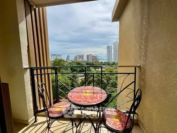 Charming balcony with city view and stylish outdoor furniture.