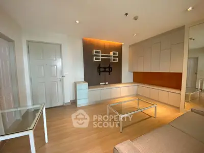 Modern living room with stylish furniture and wooden flooring