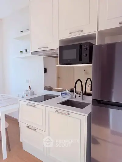 Modern kitchen with sleek appliances and minimalist design