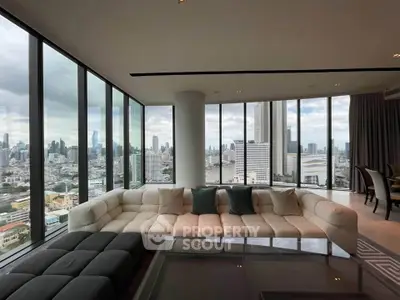 Luxurious corner unit living room with panoramic city views and elegant furnishings.