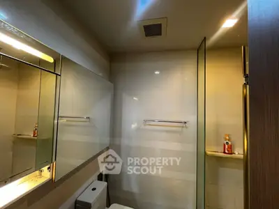 Modern bathroom with sleek mirrors and ambient lighting