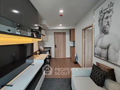 Modern living room with sleek furniture and stylish decor, featuring a striking wall art piece.