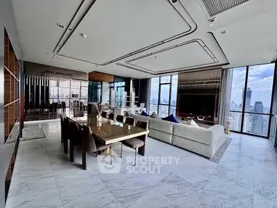 Luxurious modern living room with panoramic city views and elegant dining area.