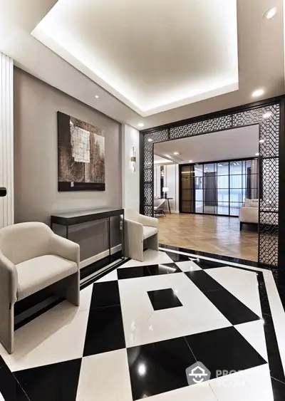 Luxurious modern lobby with elegant seating and geometric flooring