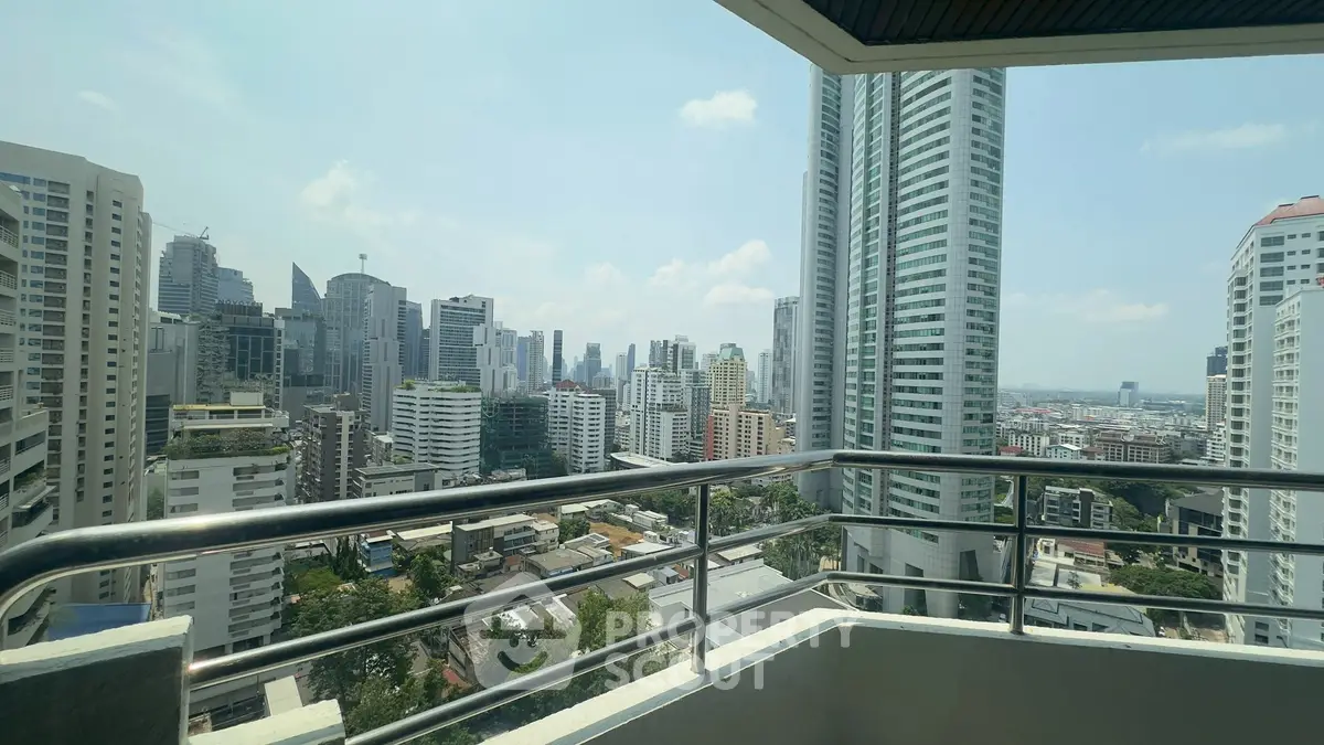 Stunning cityscape view from a high-rise balcony in a modern urban setting.