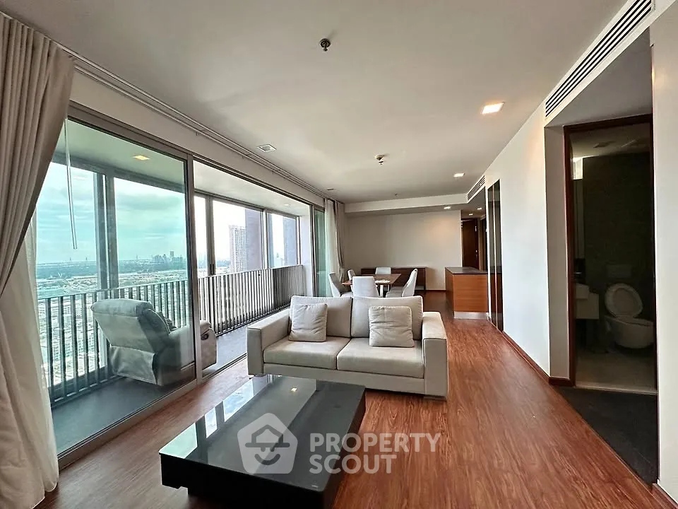 Spacious modern living room with large balcony and stunning city view