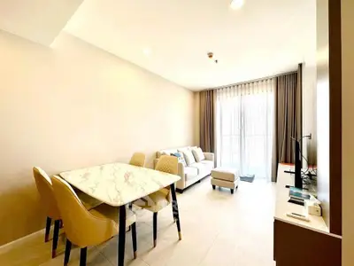 Modern living room with elegant dining area and natural light